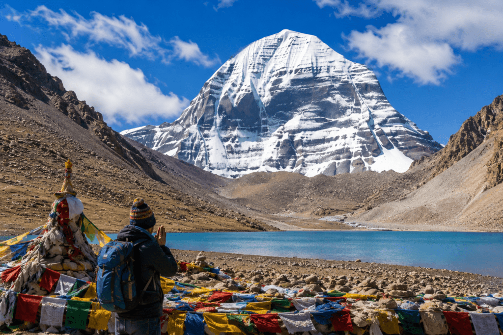 Pilgrim praying near Mount Kailash and Lake Mansarovar during spiritual yatra